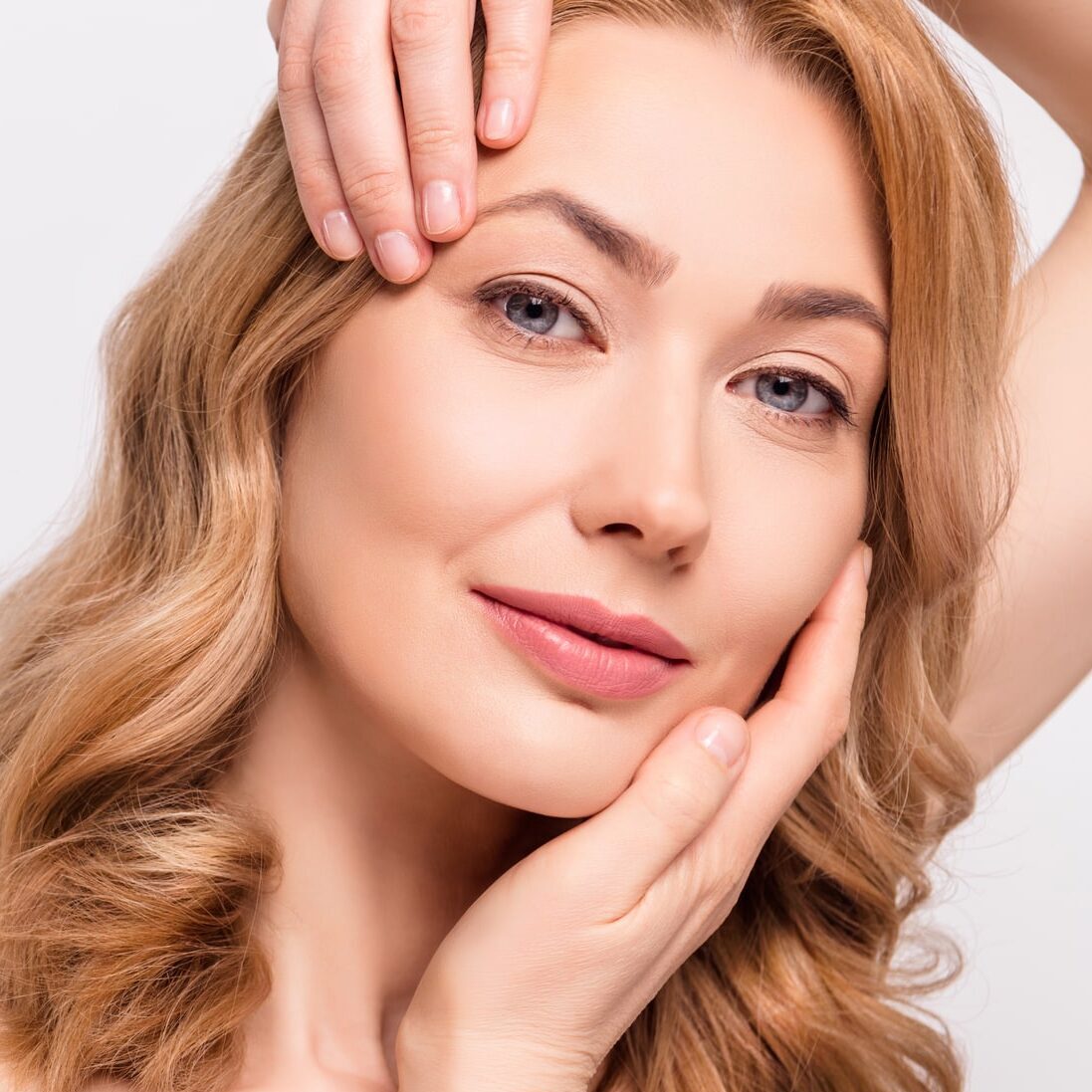 Patient receiving a non-surgical facial contouring procedure